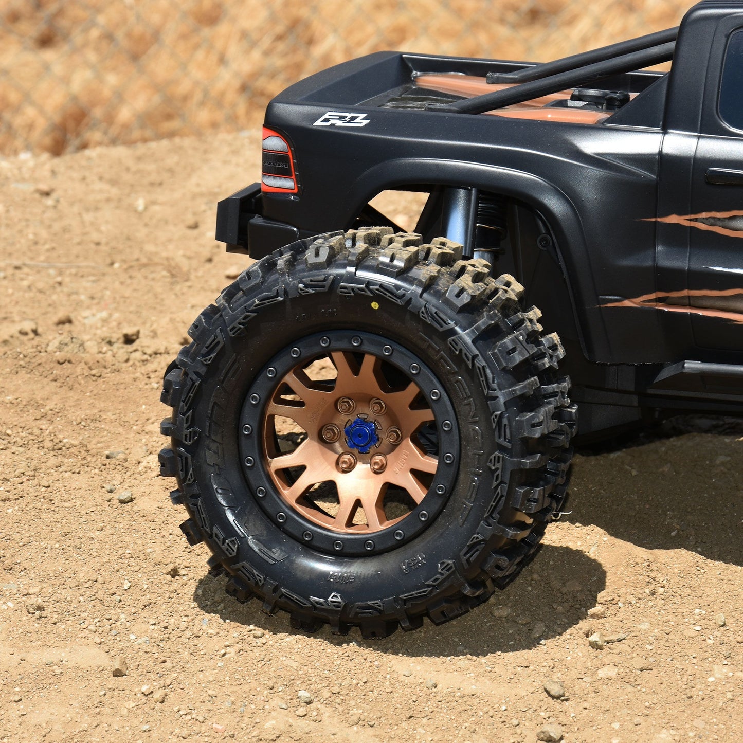 Limited Edition Trencher Pro-Loc F/R Mounted 24mm Bronze/Black Impulse (2) for X-Maxx (PRO1015115)