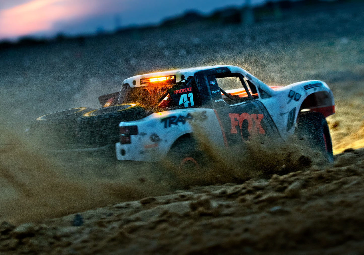 An action shot of the 1/7 Unlimited Desert Racer Ready to Run (Fox) (TRA85086-4-FOX).