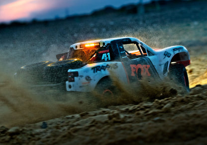 An action shot of the 1/7 Unlimited Desert Racer Ready to Run (Fox) (TRA85086-4-FOX).