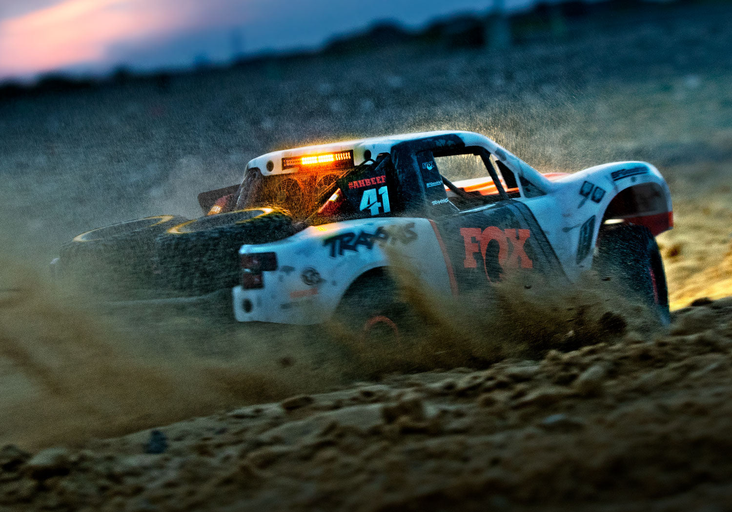 An action shot of the 1/7 Unlimited Desert Racer Ready to Run (Rigid) (TRA85086-4-RGD).